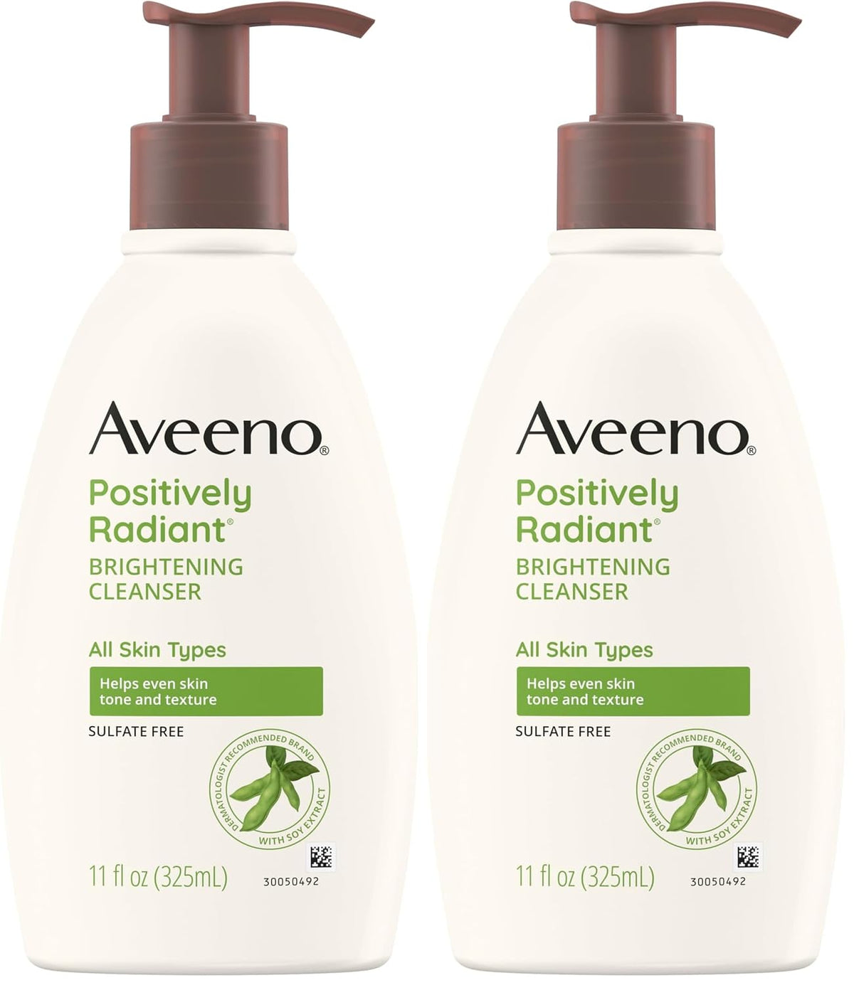 Two bottles of Aveeno Positively Radiant Brightening Cleanser side by side on a white background.