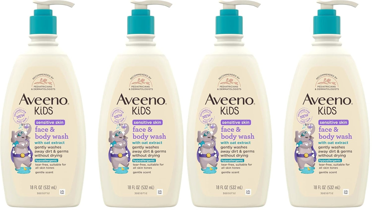 Four bottles of Aveeno Kids Face & Body Wash arranged side by side on a plain white background. The bottles are off-white with teal pump dispensers and feature purple and blue text and graphics on the labels.