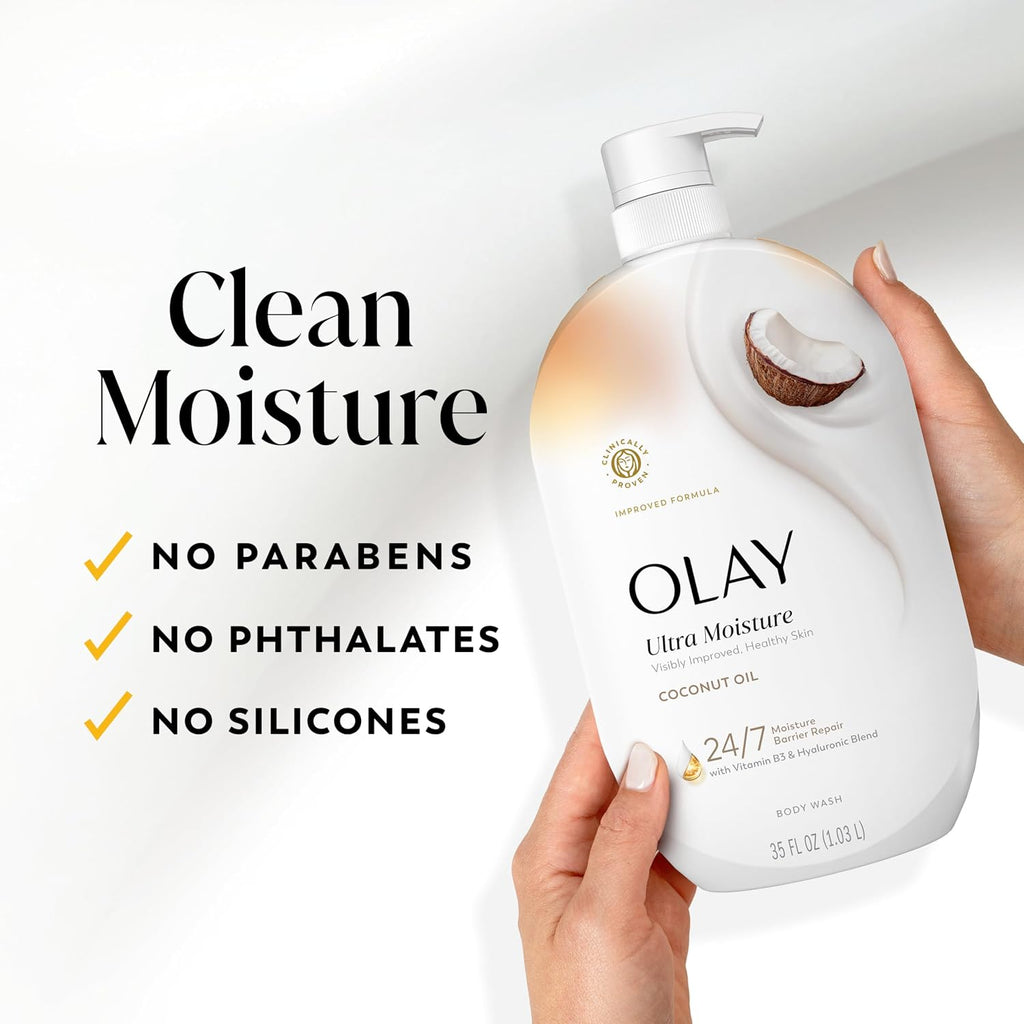 Olay Ultra Moisture coconut oil body wash bottle held by a hand with product features listed.
