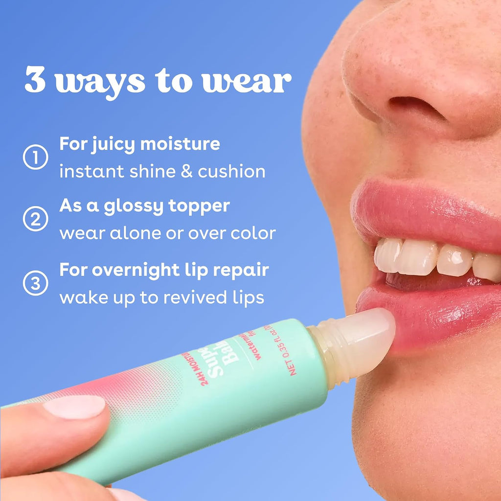 Close-up of a person applying a lip balm tube to their lips against a blue background, with text reading '3 ways to wear' and bullet points about juicy moisture, glossy topper, and overnight lip repair.