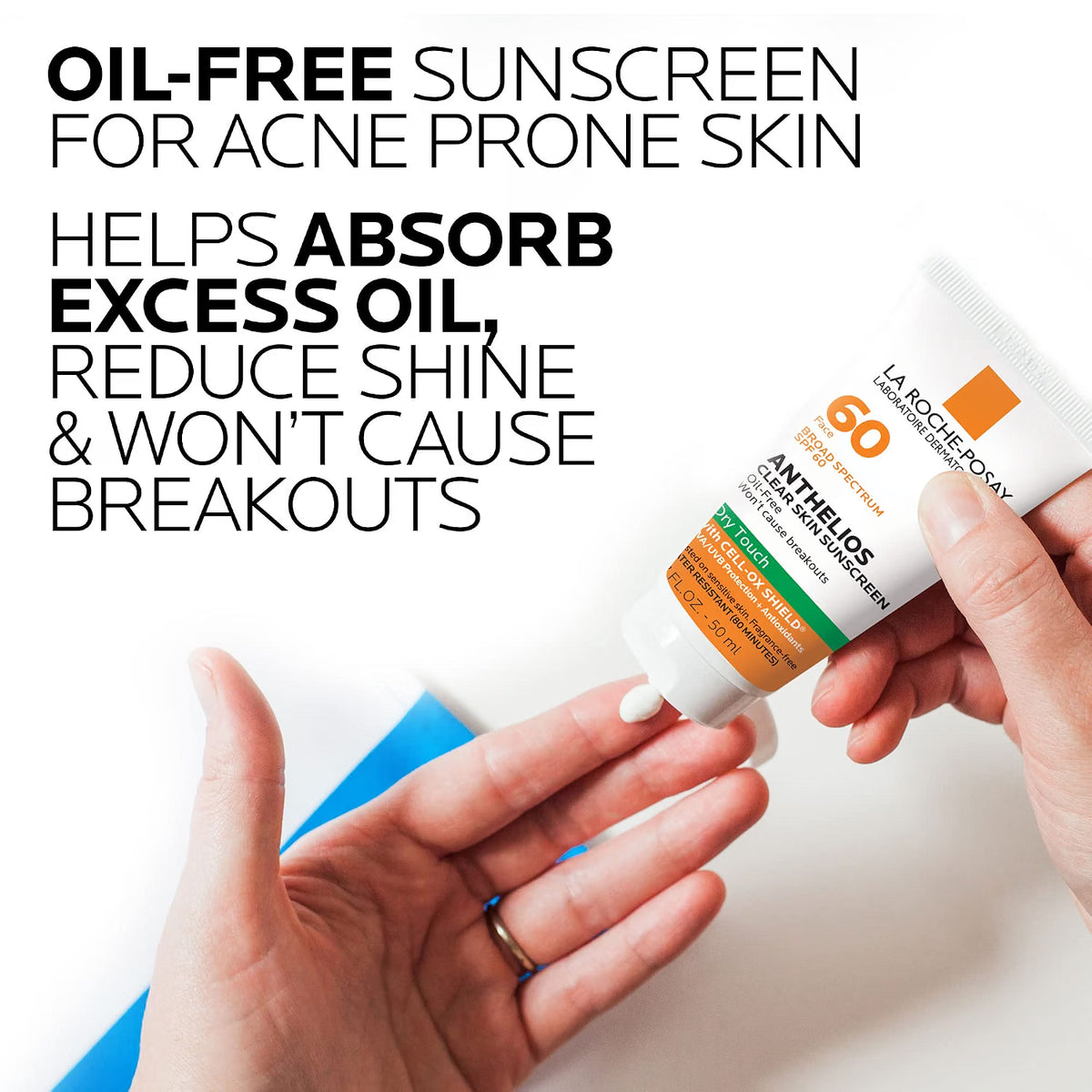 La Roche-Posay sunscreen bottle held by a hand with text about oil-free sunscreen for acne-prone skin.