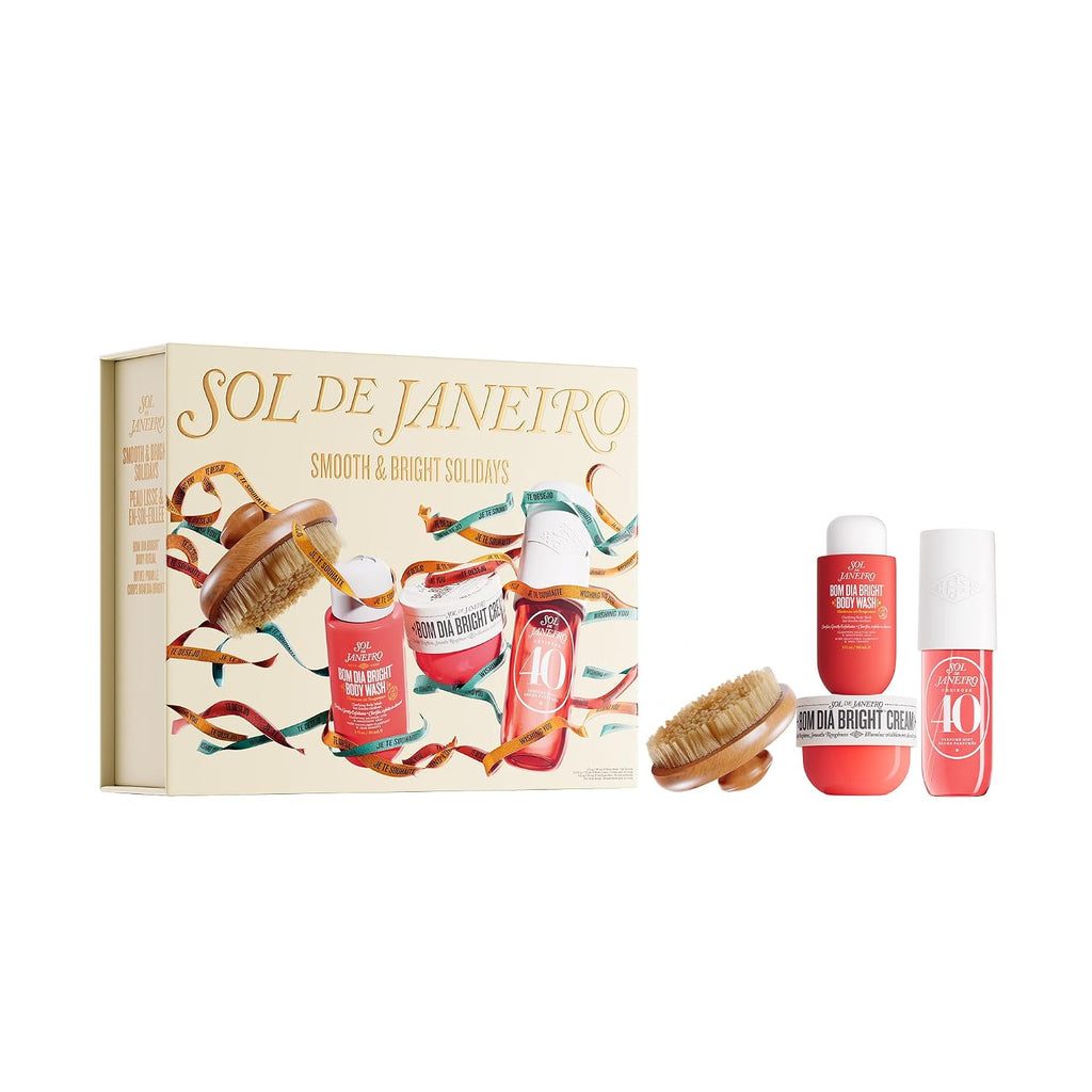 A gift set box held by two hands, featuring the brand name 'SOL DE JANEIRO' and holiday-themed illustrations of body care products and festive ribbons. Text at the top reads 'FEATURING MIDI SIZES OF PERFUME MIST (90 ML) & BODY CREAM (75 ML), PLUS A BODY BRUSH'.
