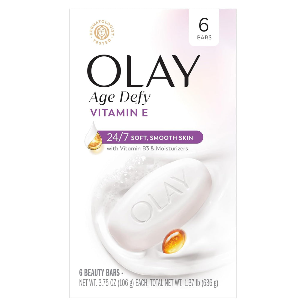 Front-facing Olay Age Defy Vitamin E skincare box showing 6 beauty bars, with a white bar of soap, a gold droplet icon, and a small amber oil drop on a clean white background.