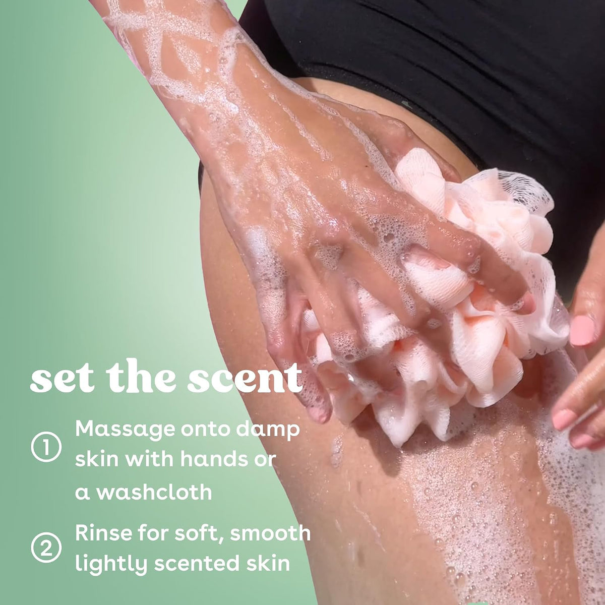 Person applying soap to their skin with a green background