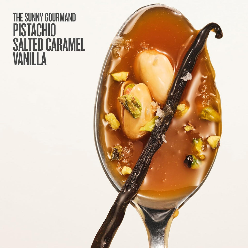 Spoon with salted caramel, vanilla beans, and pistachios on a white background