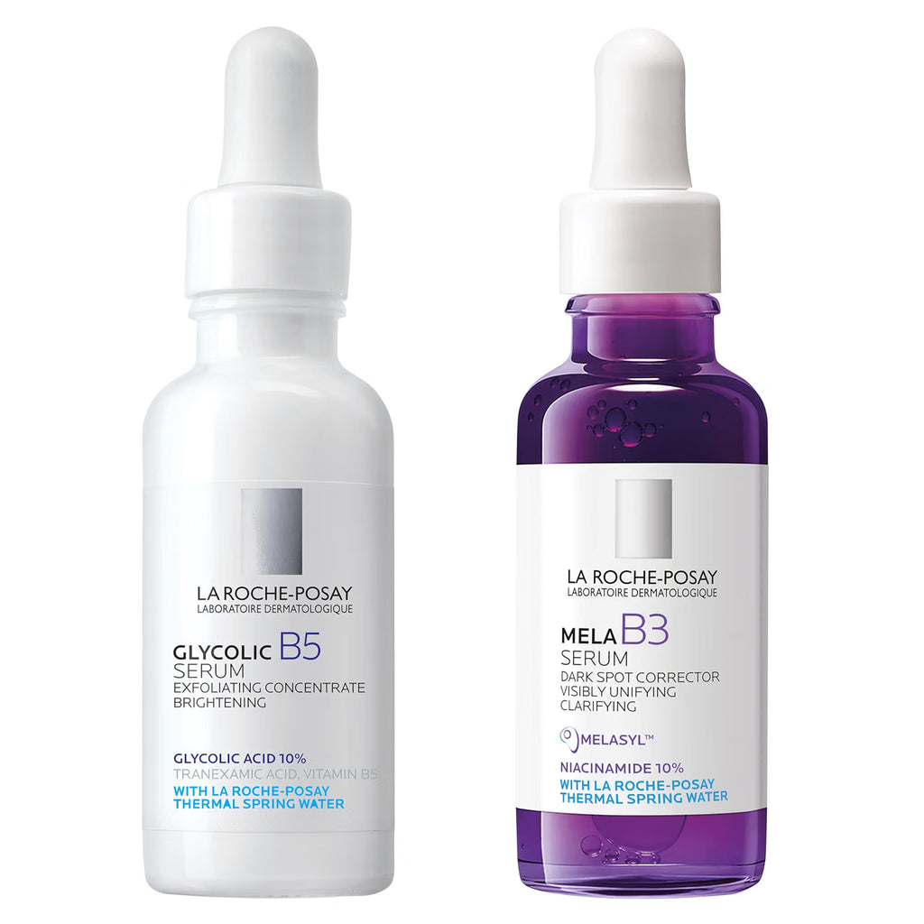 Two La Roche-Posay serum bottles, one white and one purple, on a white background.