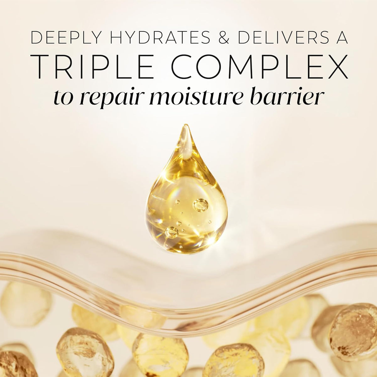 Promotional skincare graphic with the text 'DEEPLY HYDRATES & DELIVERS A TRIPLE COMPLEX to repair moisture barrier' above a clear teardrop-shaped droplet containing golden-yellow liquid, with translucent oil droplets along a curved glass line on a warm cream background.