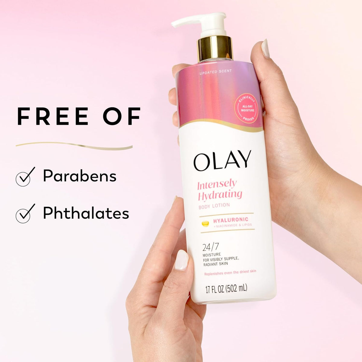 Olay Intensely Hydrating body lotion held by a hand with a pink background