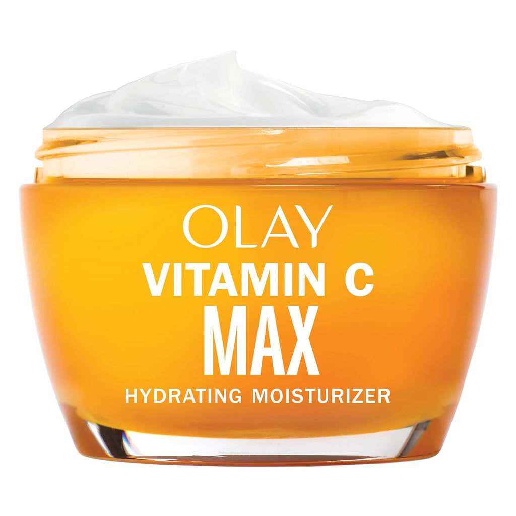 Olay Vitamin C Max Hydrating Moisturizer in a clear glass jar with a golden-orange tint, showing white cream on top, on a white background.