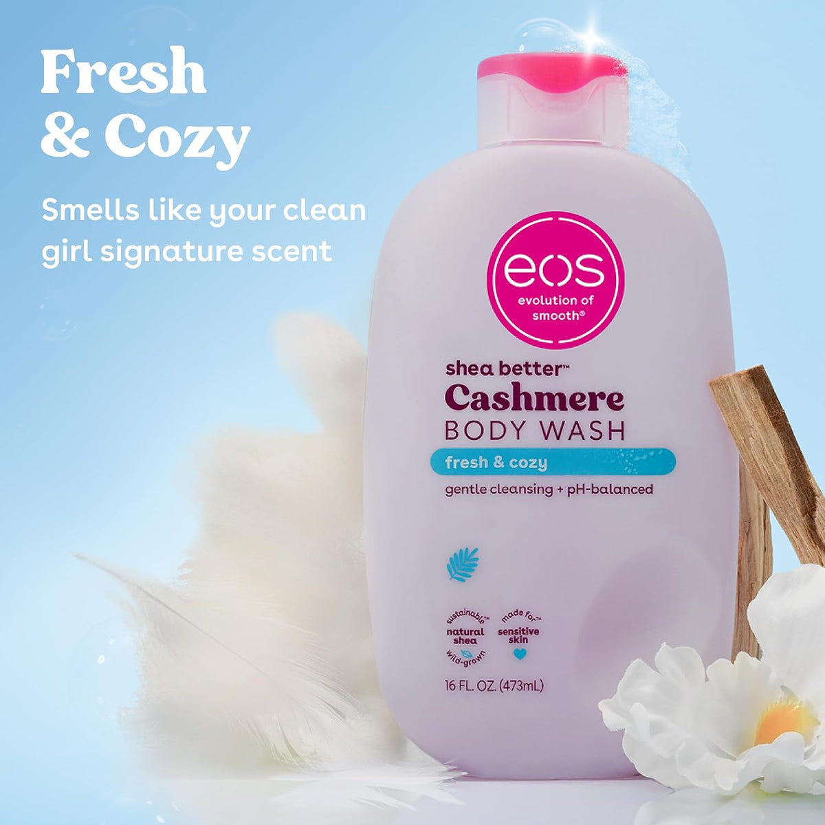 Shea Cashmere Body Wash bottle with branding and product details on a light blue background