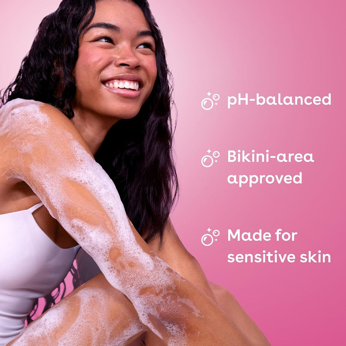 Woman with foamy product on her arm against a pink background with text about product features.