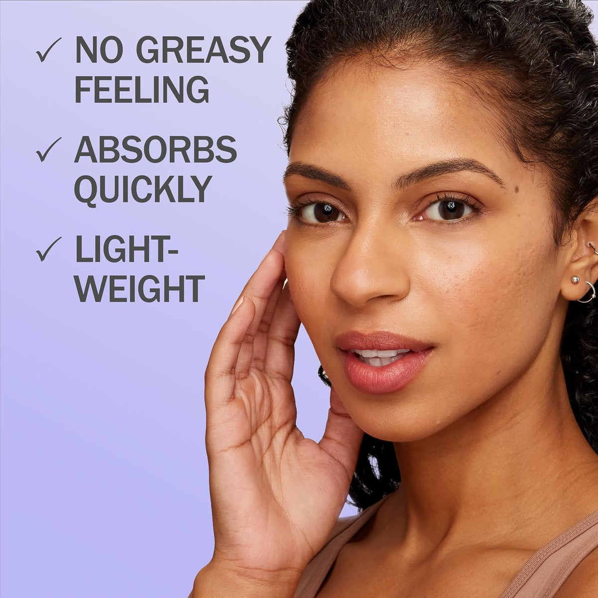 A close-up of a woman touching her face next to text that reads 'NO GREASY FEELING', 'ABSORBS QUICKLY', and 'LIGHT-WEIGHT' on a light purple background.