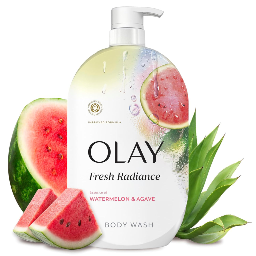 A bottle of Olay Fresh Radiance body wash with watermelon and agave graphics, styled with watermelon slices and green agave leaves on a white background.