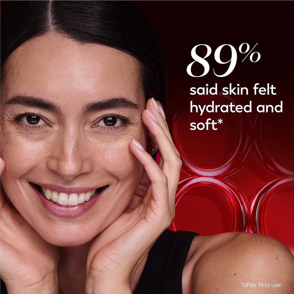 Close-up of a smiling woman with her hands on her cheeks against a dark red background with white text reading '89% said skin felt hydrated and soft' and small text 'after first use'.