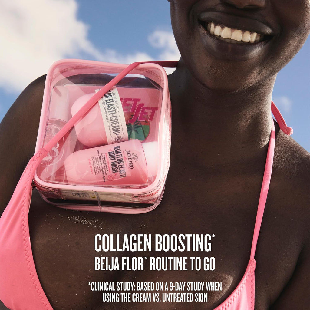 Person holding a pink toiletry bag with 'Beija Flor' products against a blue sky.