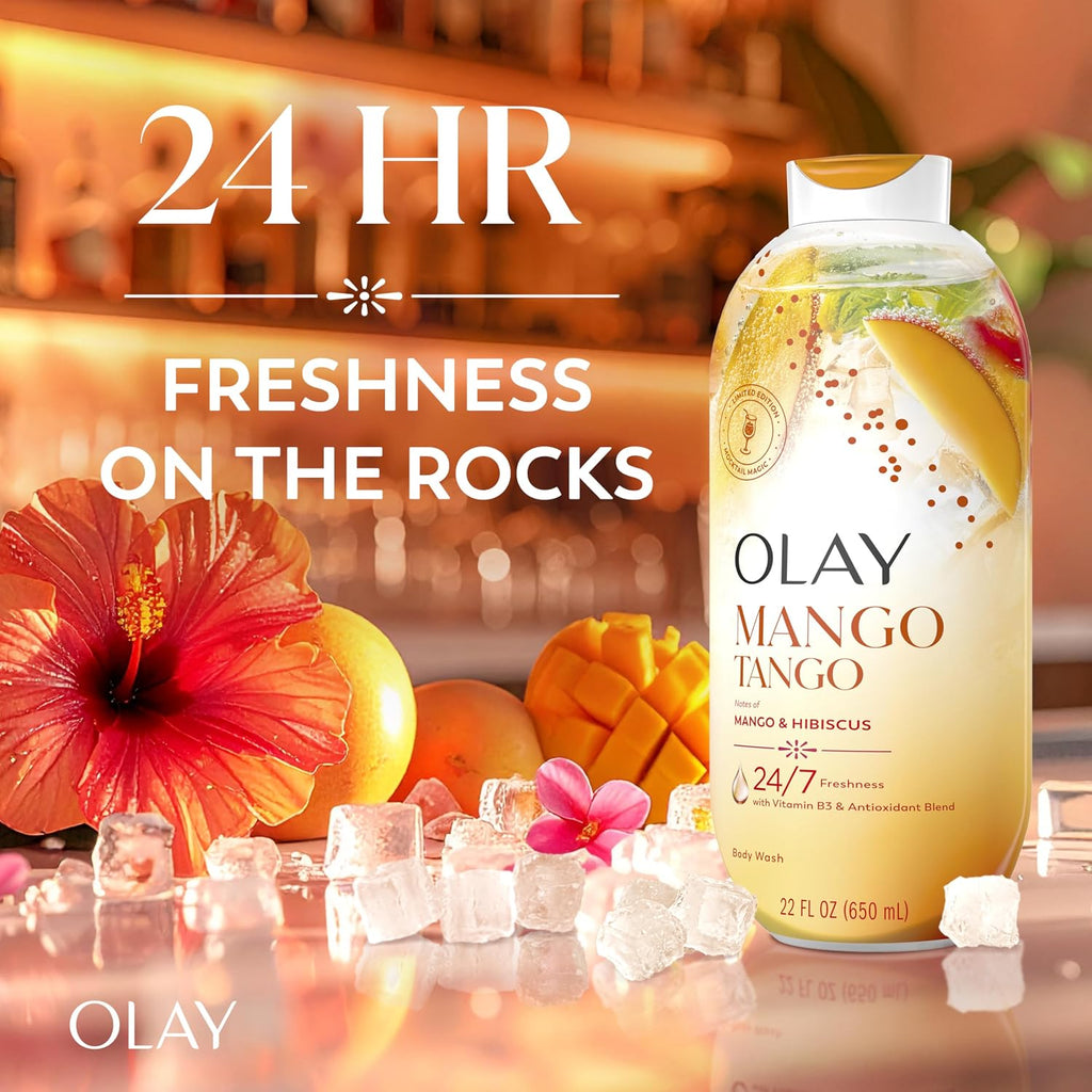 Olay Mango Tango body wash bottle displayed on a reflective surface with tropical fruit, a hibiscus flower, ice cubes, and large promotional text reading '24 HR FRESHNESS ON THE ROCKS' and 'OLAY'.