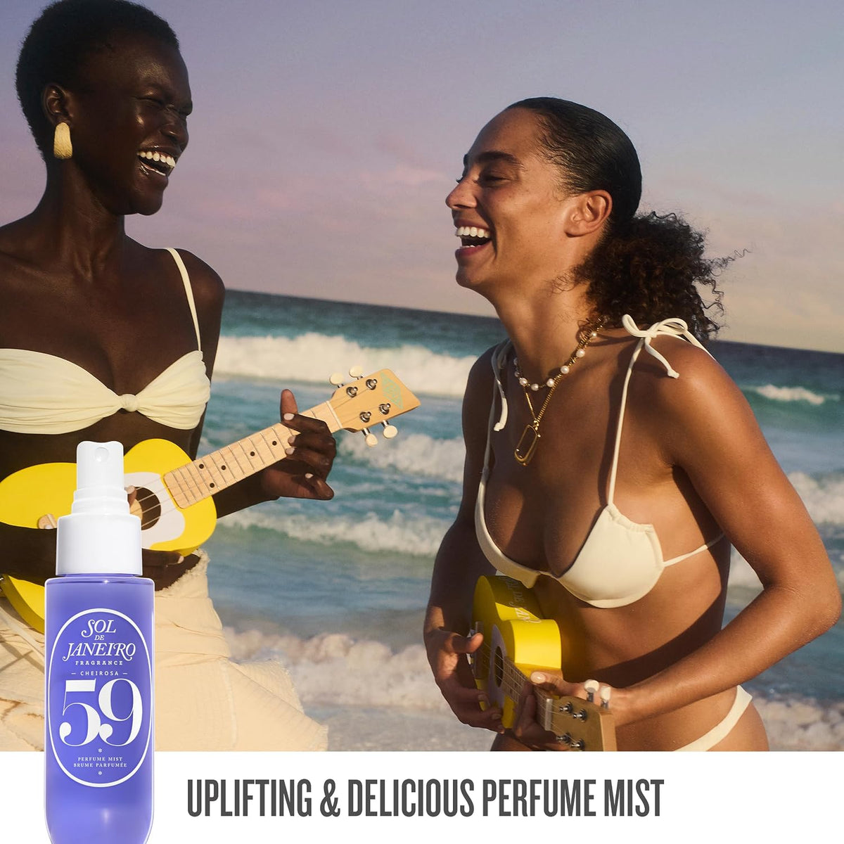 Two women on a beach playing ukuleles with a bottle of Sol de Janeiro 59 perfume mist.