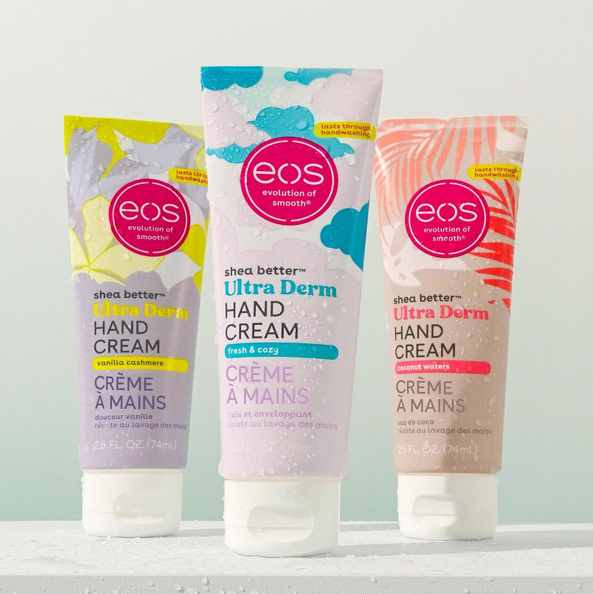 Three tubes of eos Ultra Derm Hand Cream on a light gray background