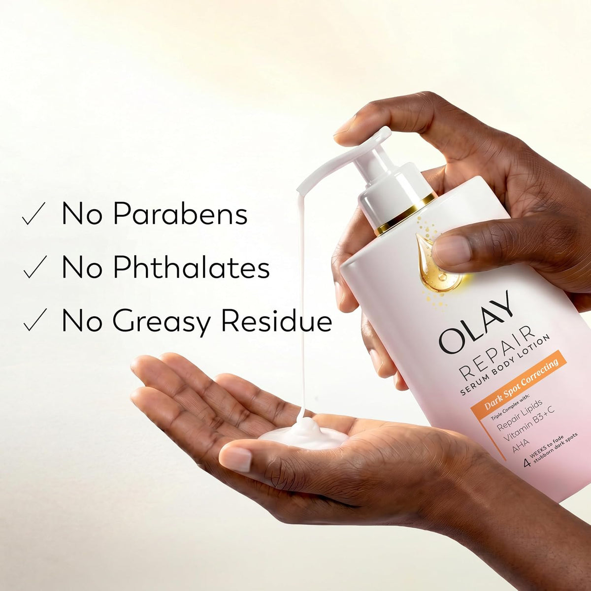 A person's hands are shown holding and dispensing Olay Repair Serum Body Lotion onto a palm, with text on the left listing benefits: No Parabens, No Phthalates, No Greasy Residue.