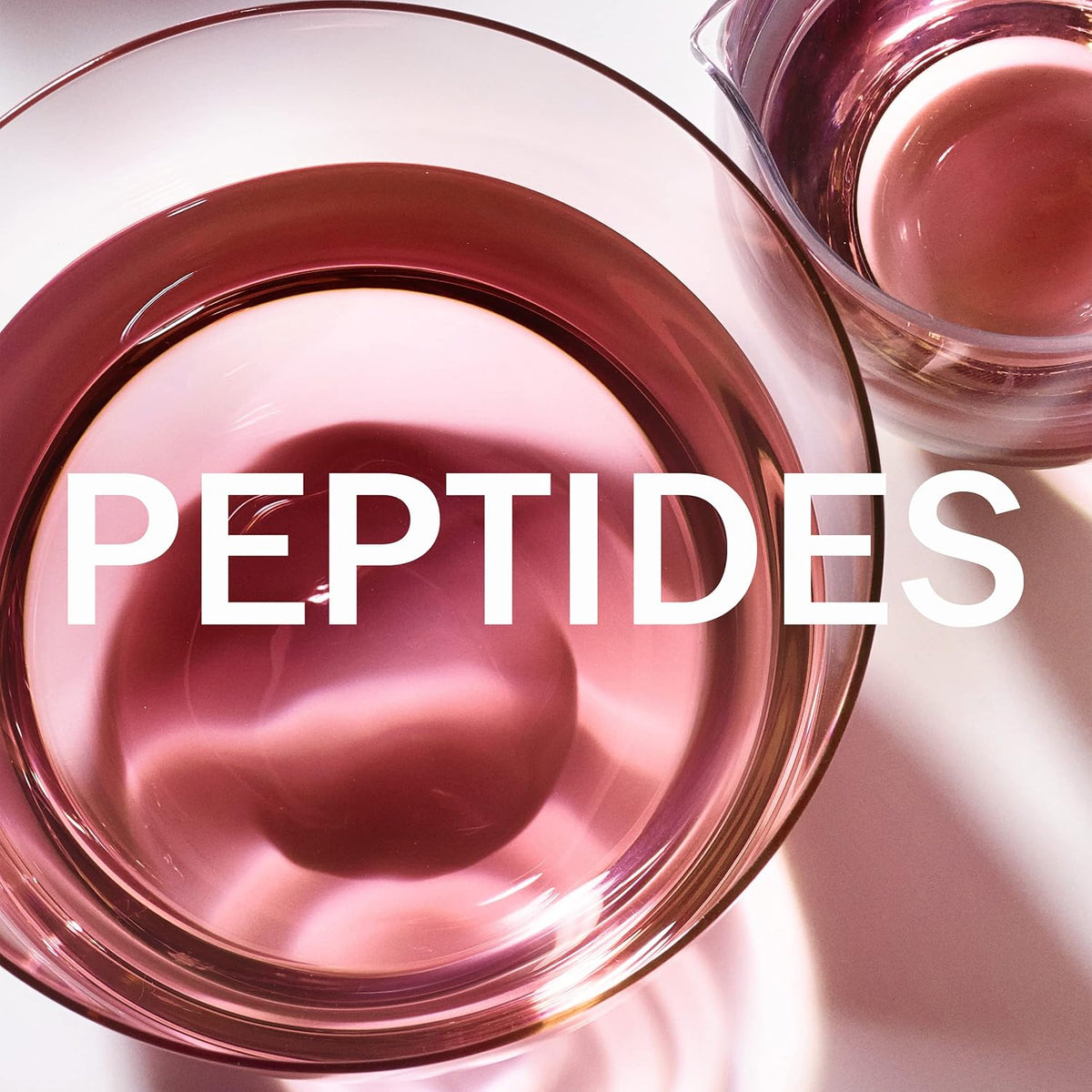 Pink jar of skincare product with 'PEPTIDES' text on a light background