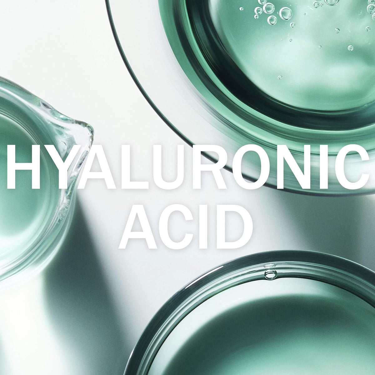 Close-up of hyaluronic acid solution in petri dishes with the text 'HYALURONIC ACID'.