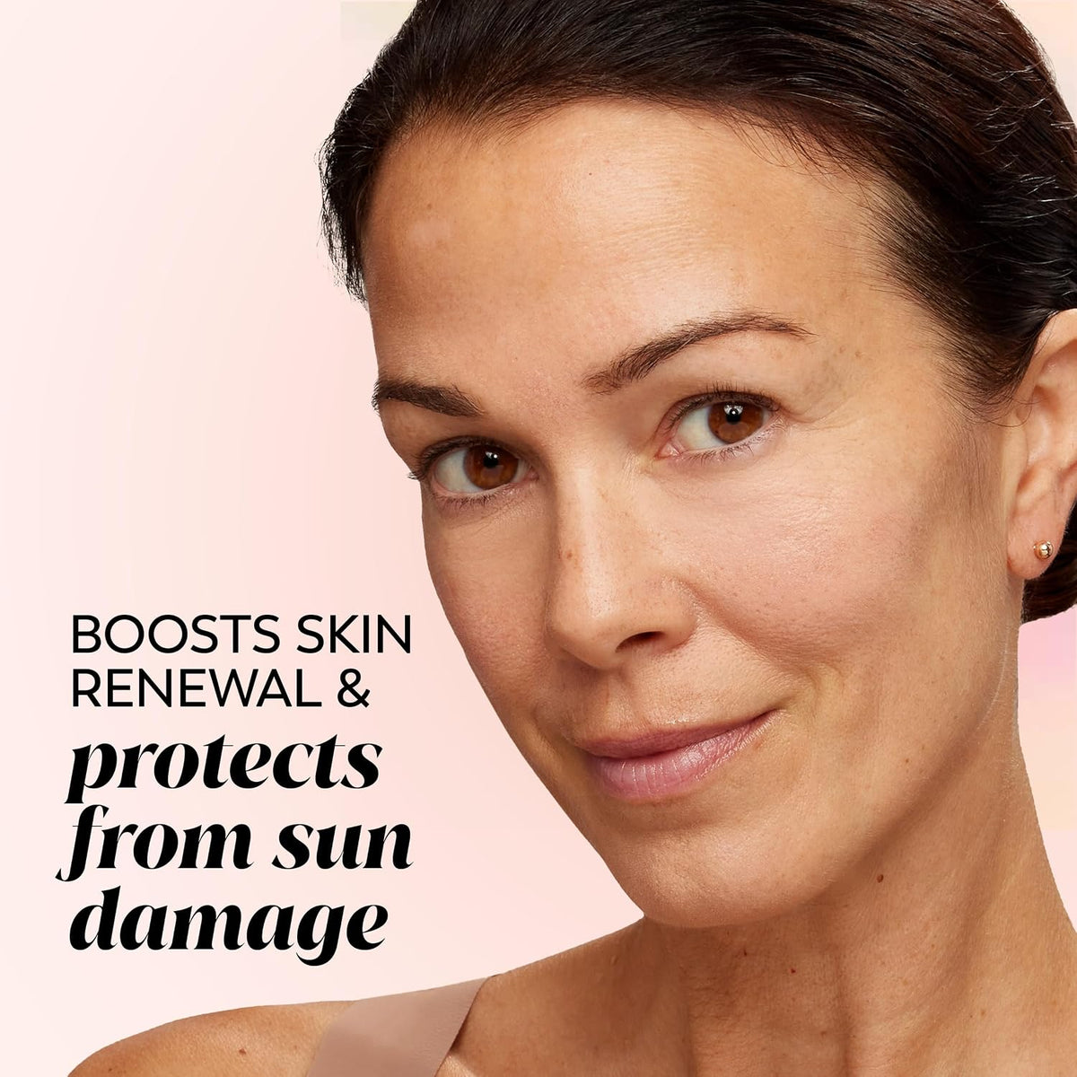 Woman's face with text about skin renewal and sun damage protection on a pink background