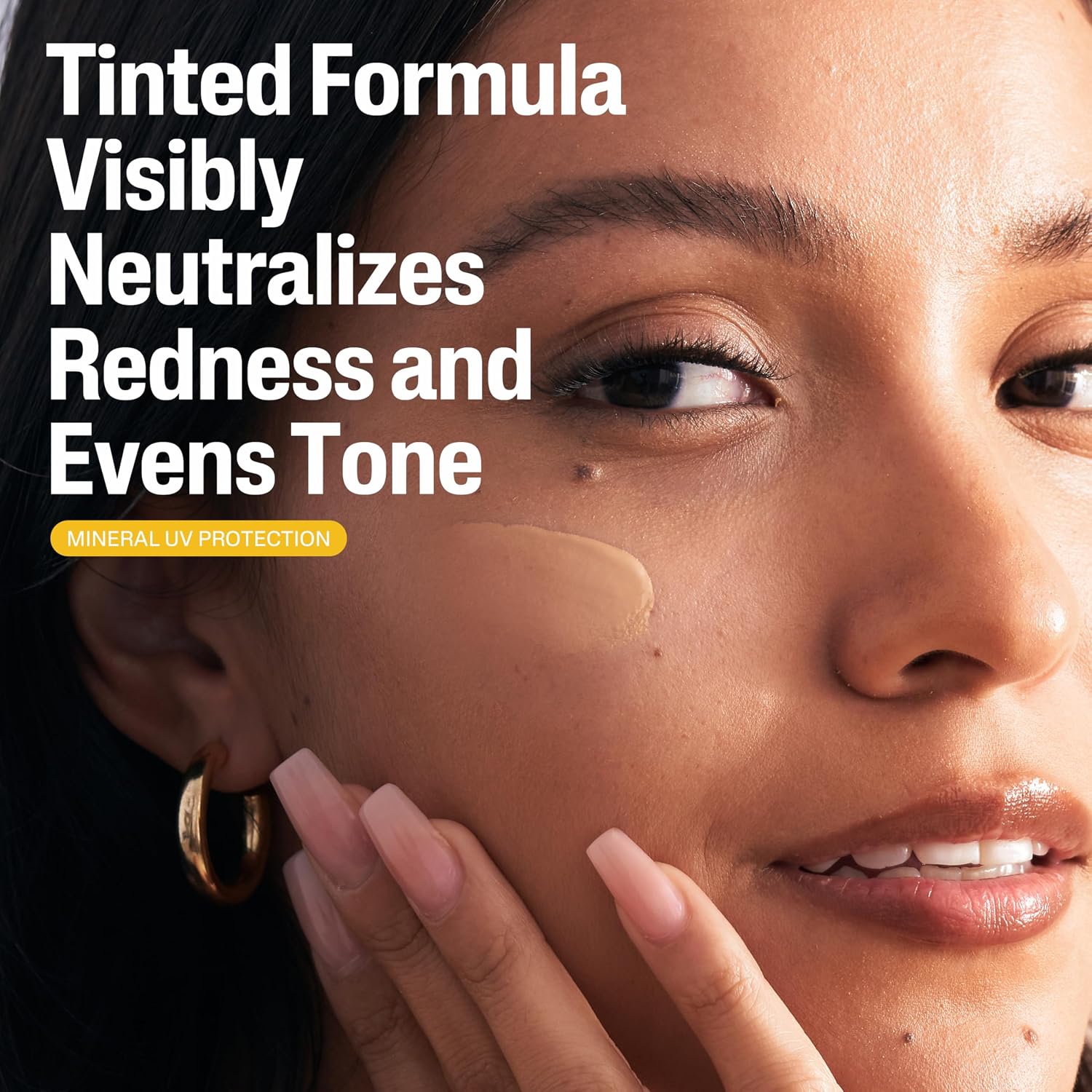 Woman applying a cosmetic product to her face with text about tinted formula benefits.