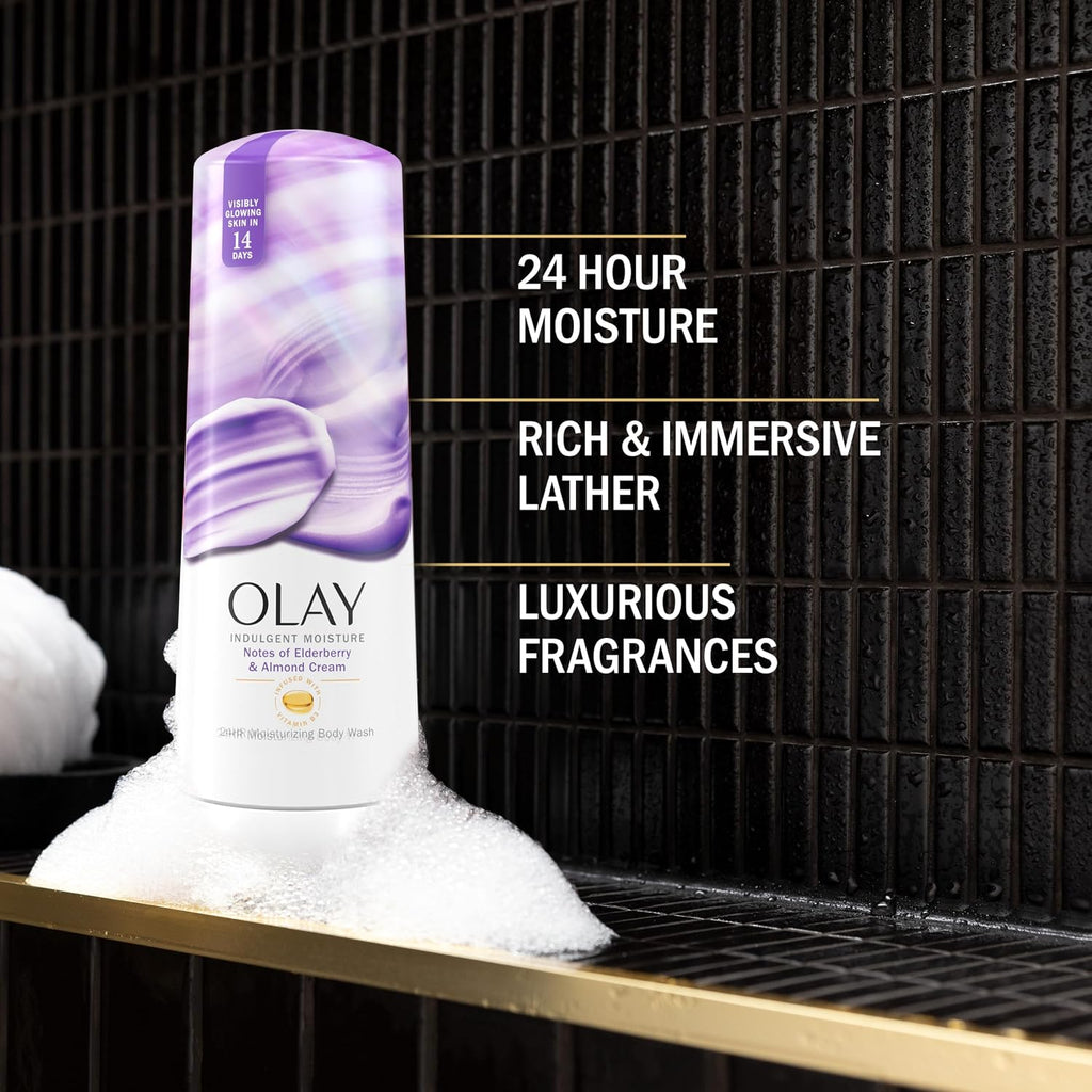 Olay沐浴露瓶子在泡沫中，背景是黑色的瓷砖墙，带有产品特点文字。