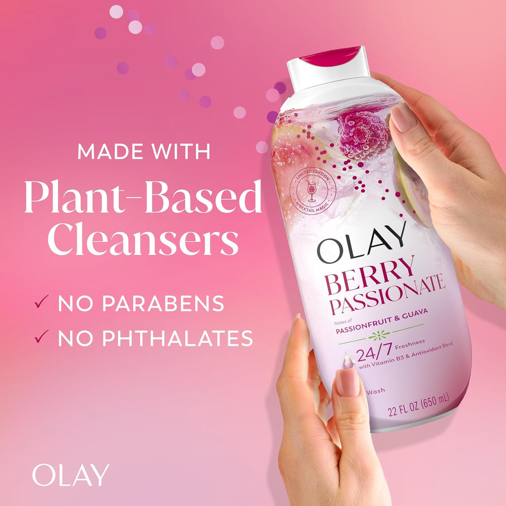 OLAY Berry Passionate cleanser bottle held by a hand on a pink background with product details.