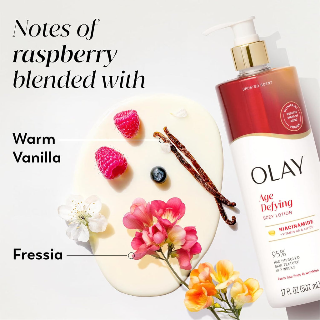 Olay Age Defying Body Lotion with raspberry, vanilla, and flowers on a white background