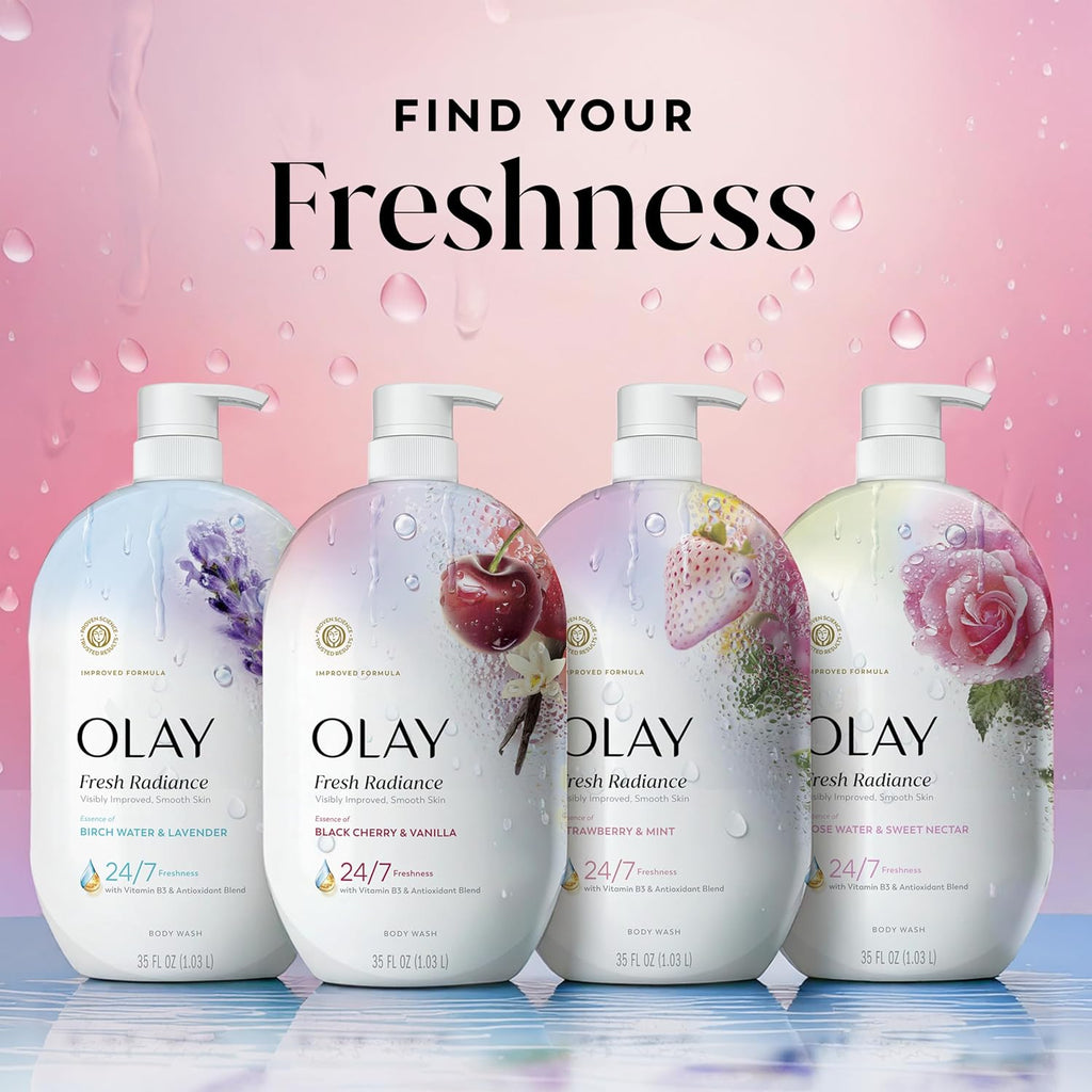 Four Olay Fresh Radiance body wash bottles displayed side by side against a pink water-droplet background with the text 'FIND YOUR Freshness' above them. The bottles feature white pump dispensers and floral/fruit illustrations including lavender, an apple, strawberries, and a rose.