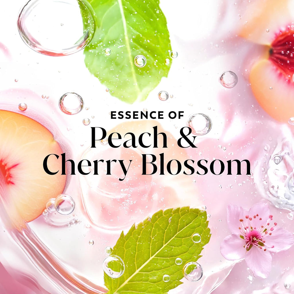 Product packaging with peach slices, cherry blossoms, and green leaves on a pink background with water droplets.