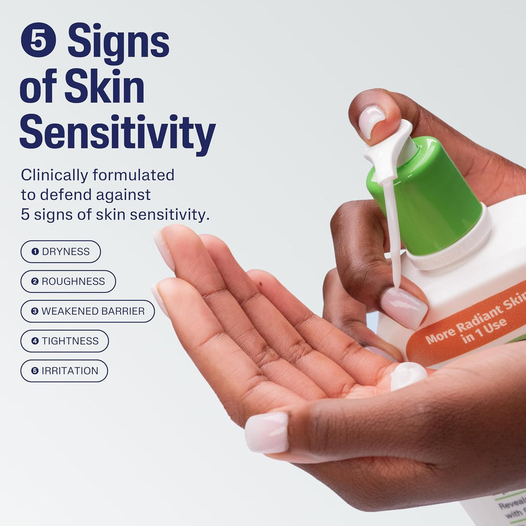Hand holding a bottle of skincare product with text about skin sensitivity and product features.