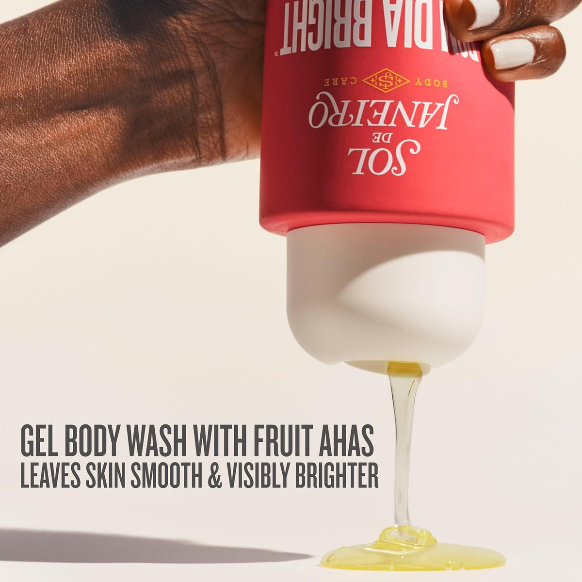 Red bottle of 'Anelito de Sol' gel body wash being squeezed with text highlighting benefits.