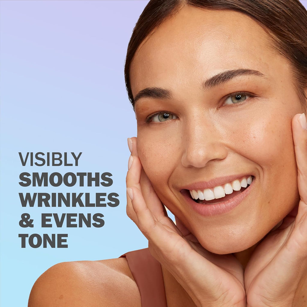 A smiling woman with smooth, radiant skin poses with her hands on her cheeks against a soft blue gradient background. Bold text on the left reads, 'VISIBLY SMOOTHS WRINKLES & EVENS TONE.