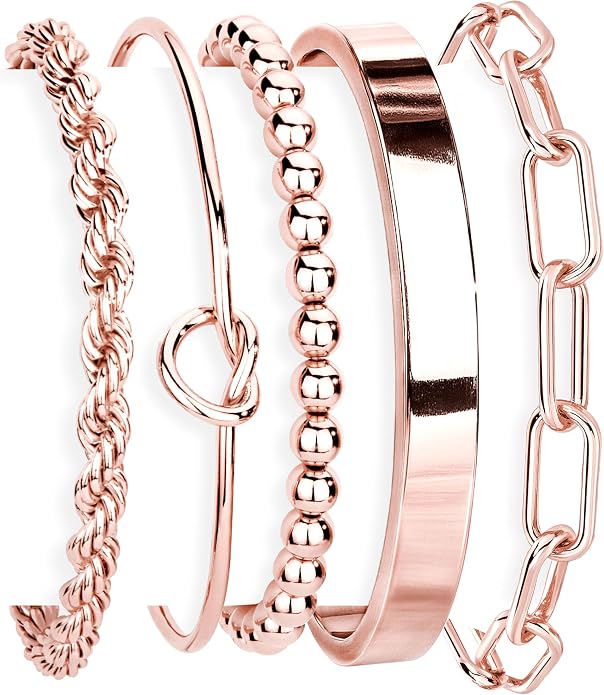 Set of rose gold bracelets with different designs on a white background