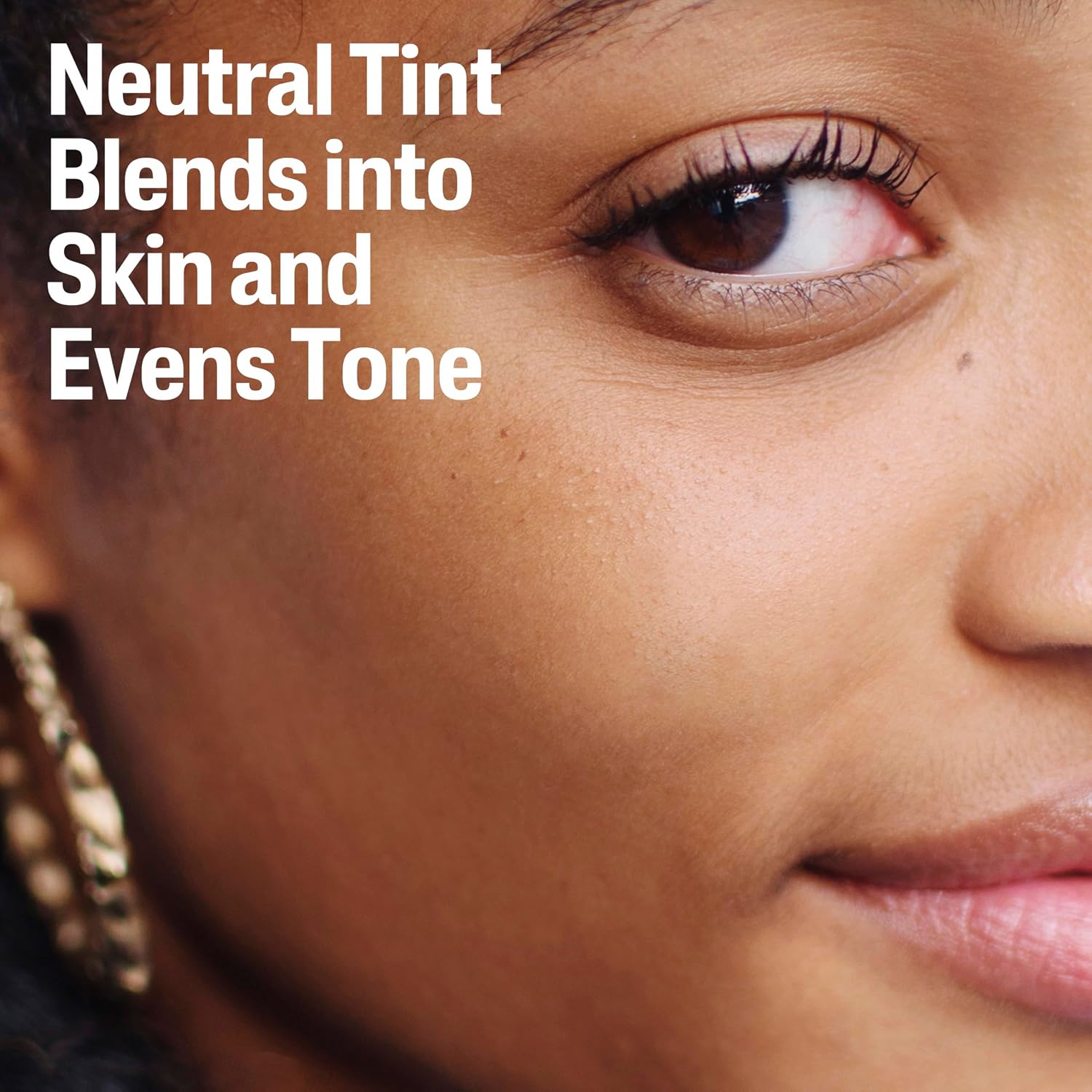 Close-up of a person's eye with text about neutral tint makeup