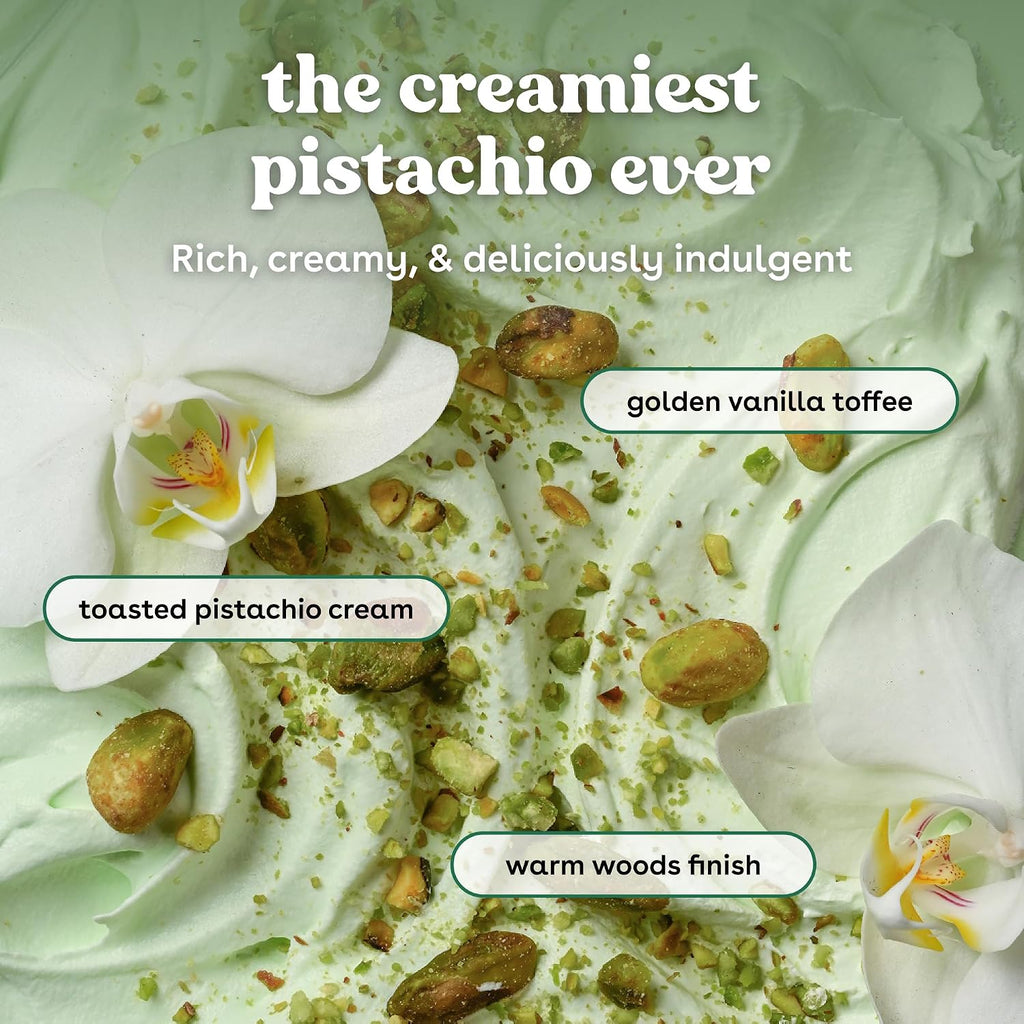 Pistachio dessert with whipped cream, toasted pistachios, and orchids on a white background.