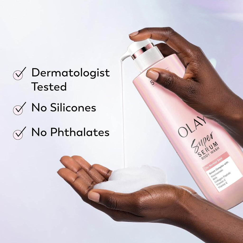 A hand holds a pink Olay Super Serum Body Wash bottle while dispensing white foam into the other hand. Text on the left reads 'Dermatologist Tested', 'No Silicones', and 'No Phthalates' on a clean light background.