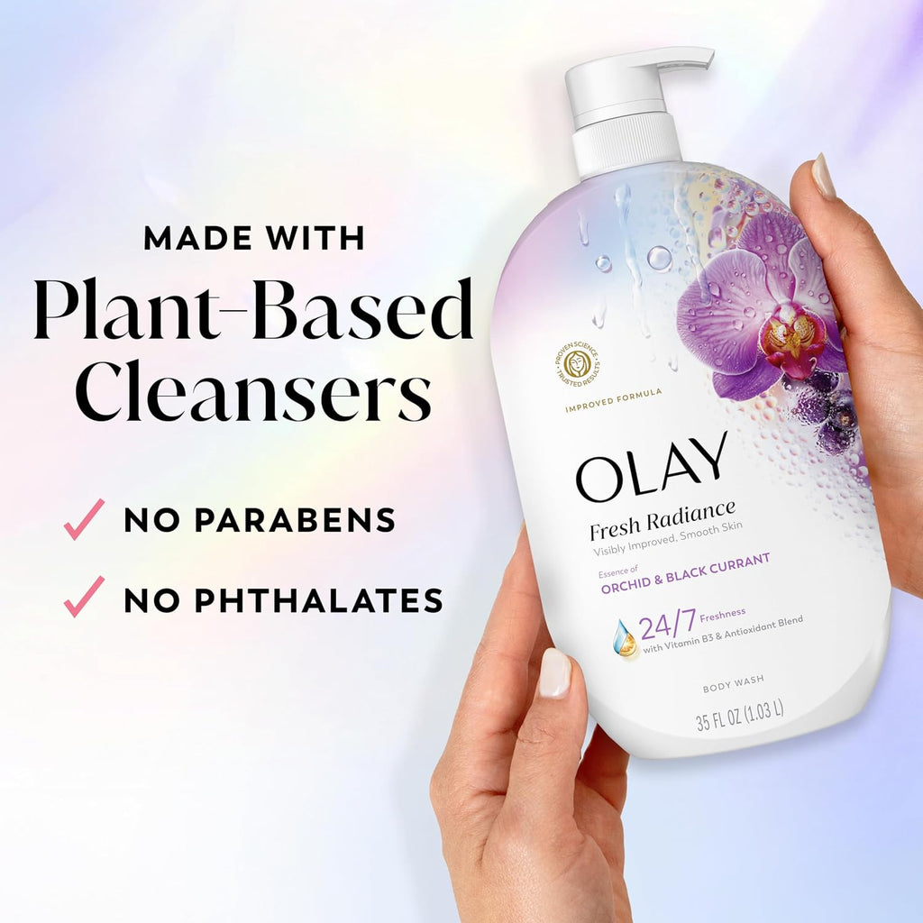 Olay body wash bottle held by a hand with plant-based cleanser information on a gradient background