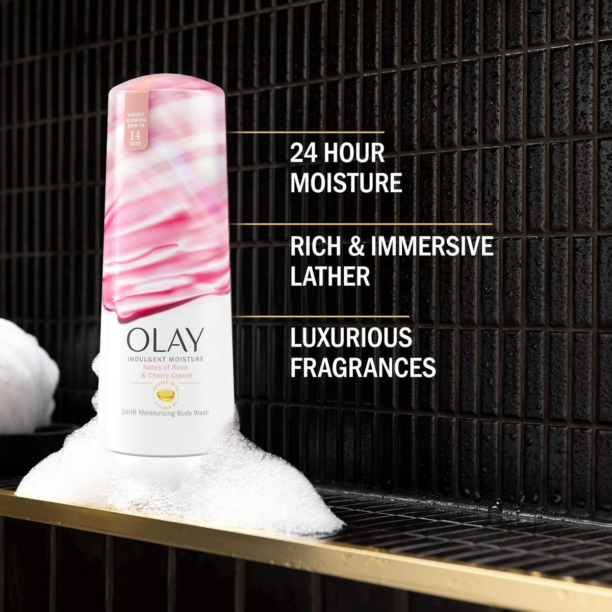 Olay body wash bottle with text highlighting features on a black tiled background