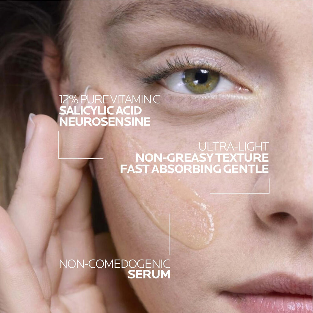 Close-up of a person applying a skincare serum with product details on a white background