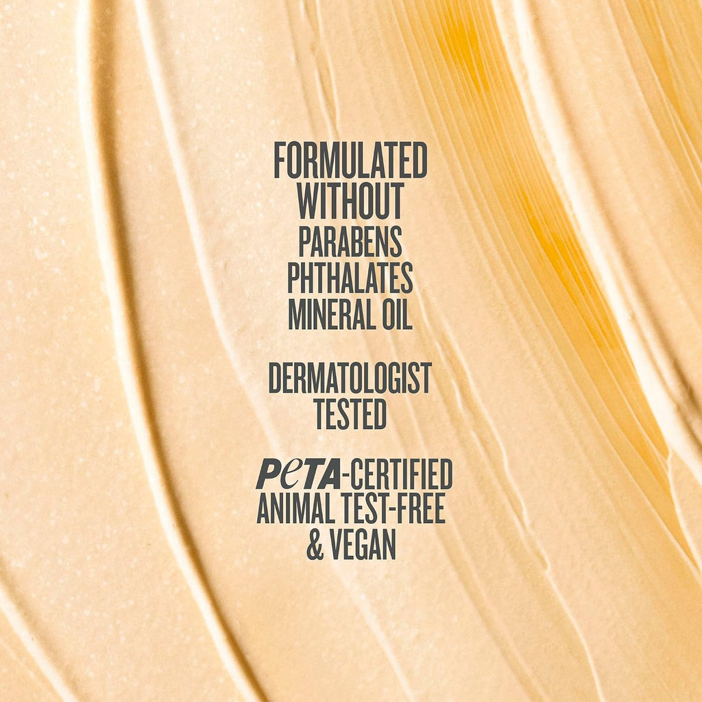 A close-up textured swatch of creamy beige cosmetic cream with dark gray text overlay reading 'FORMULATED WITHOUT PARABENS PHthalates MINERAL OIL DERMATOLOGIST TESTED PETA-CERTIFIED ANIMAL TEST-FREE & VEGAN'.