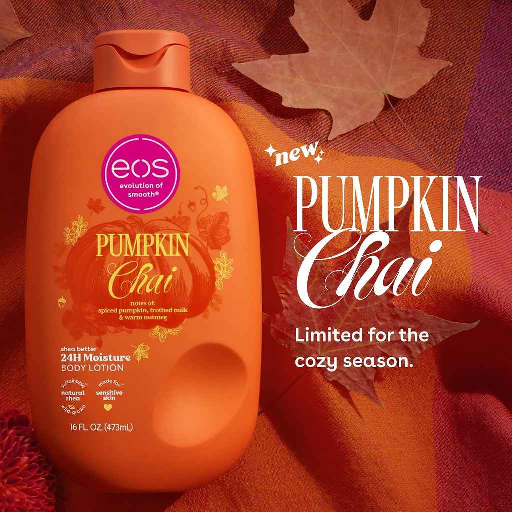 A bottle of EOS Evolution of Smoothies Pumpkin Chai 24H Moisture Body Lotion placed on a textured orange and red fabric background with autumn leaves. The bottle is orange with a pink circular EOS logo and gold decorative text.