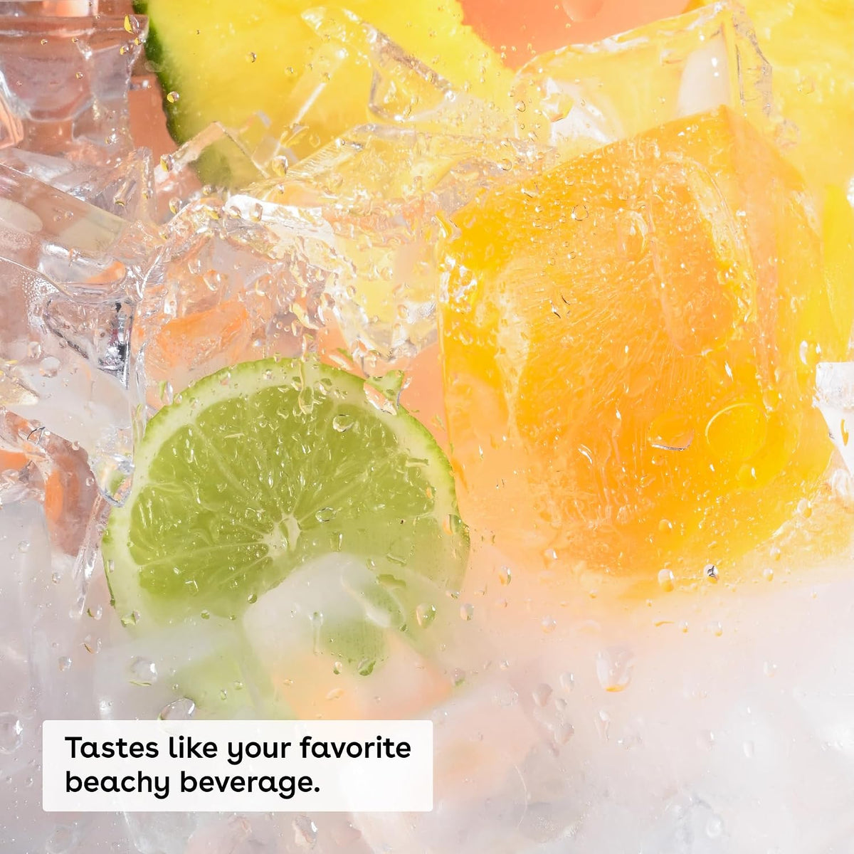Close-up of a refreshing beverage with ice cubes, a lime slice, and orange-colored liquid, with the text 'Tastes like your favorite beachy beverage.'.