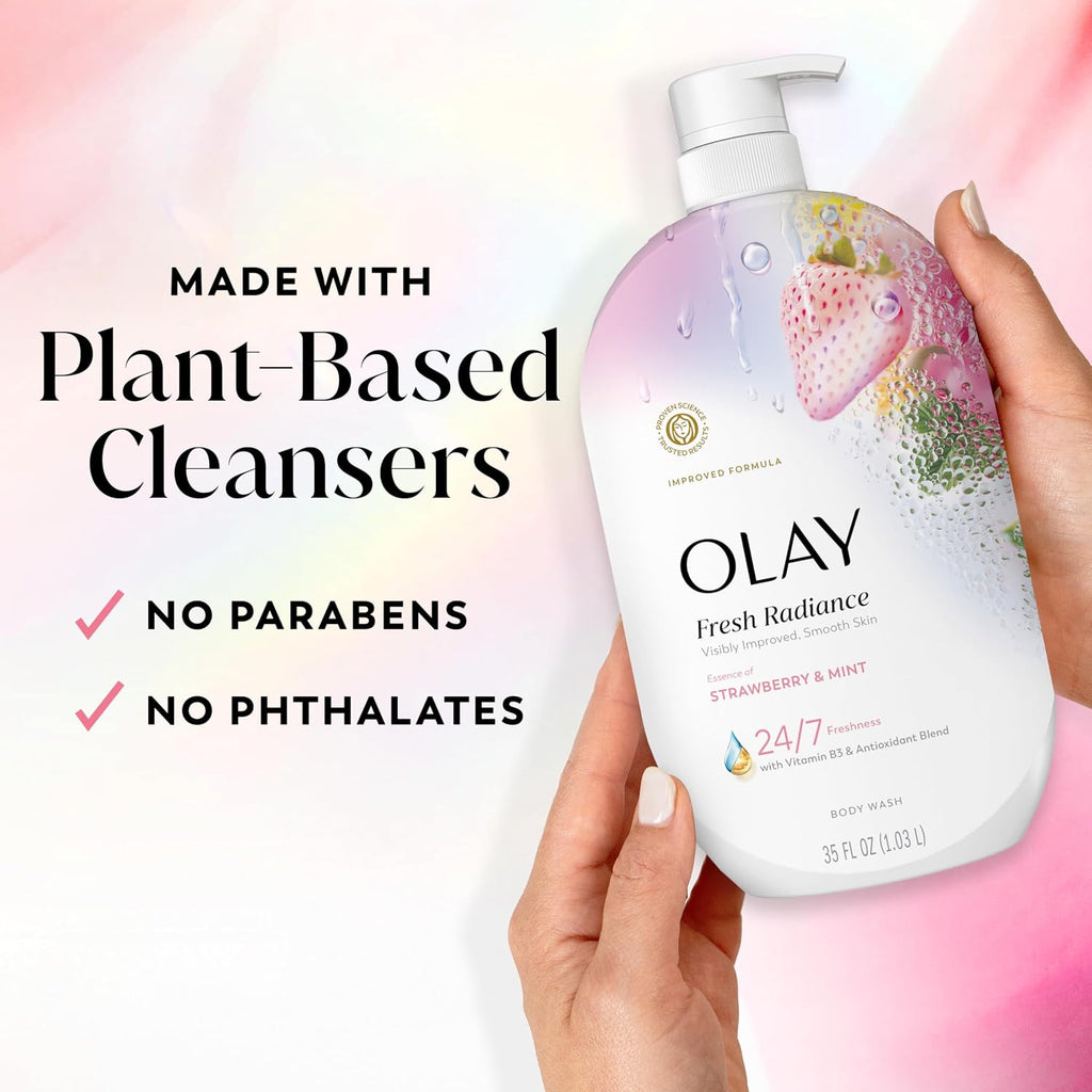 Olay body wash bottle held by a hand with plant-based cleanser information on a colorful background
