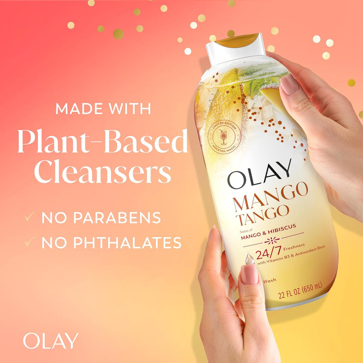 Olay Mango Tango cleanser bottle held by a hand with a gradient background