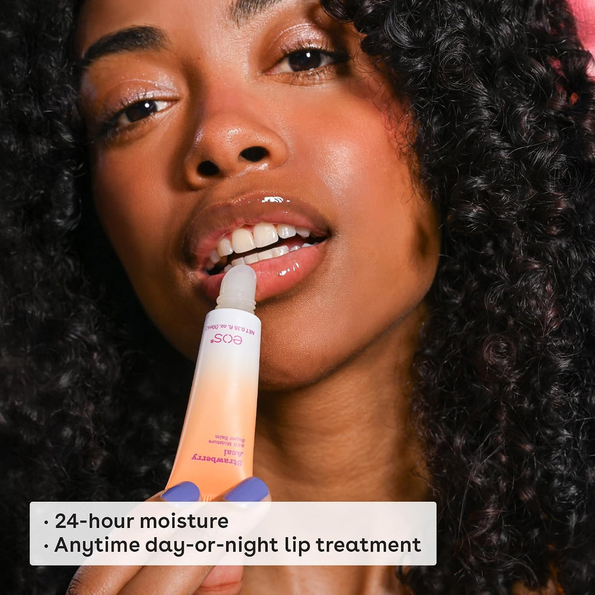 A woman with the Eos Lip balm And 24 hour Moisture , Anytime day or Night lip treatment
