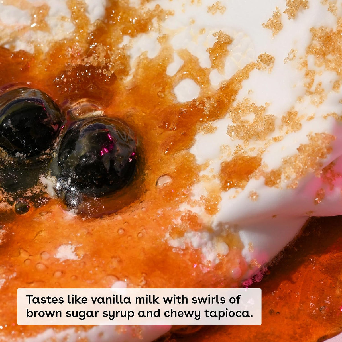 Close-up of a dessert with vanilla milk, brown sugar syrup, and chewy tapioca.