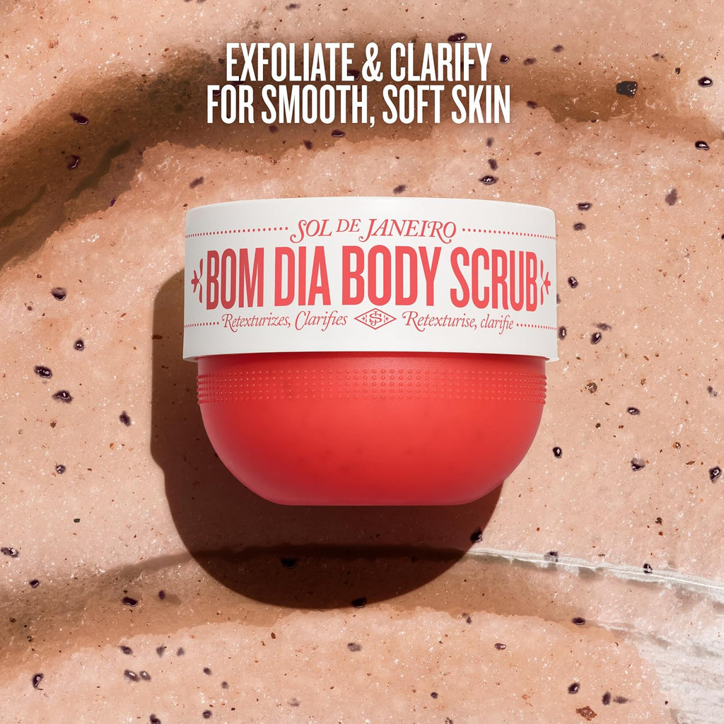 Red jar of Bom Dia Body Scrub with text on a textured beige background